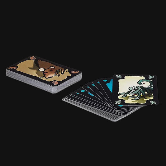 A deck of illustrated cards shown, with one stack standing upright and one fan of cards spread out. The card backs are dark with animal illustrations, and the fanned cards show black borders with teal and cream artwork.